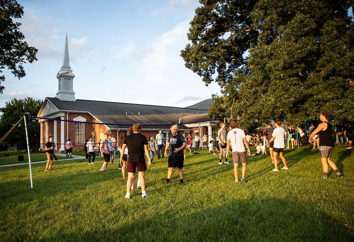 Students playing field games outside the institute building