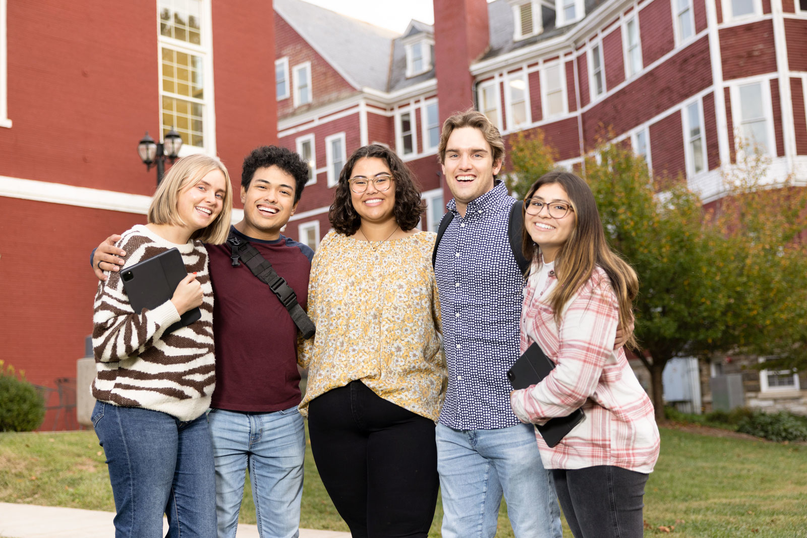 Group of Southern Virginia University students standing behind Main Hall