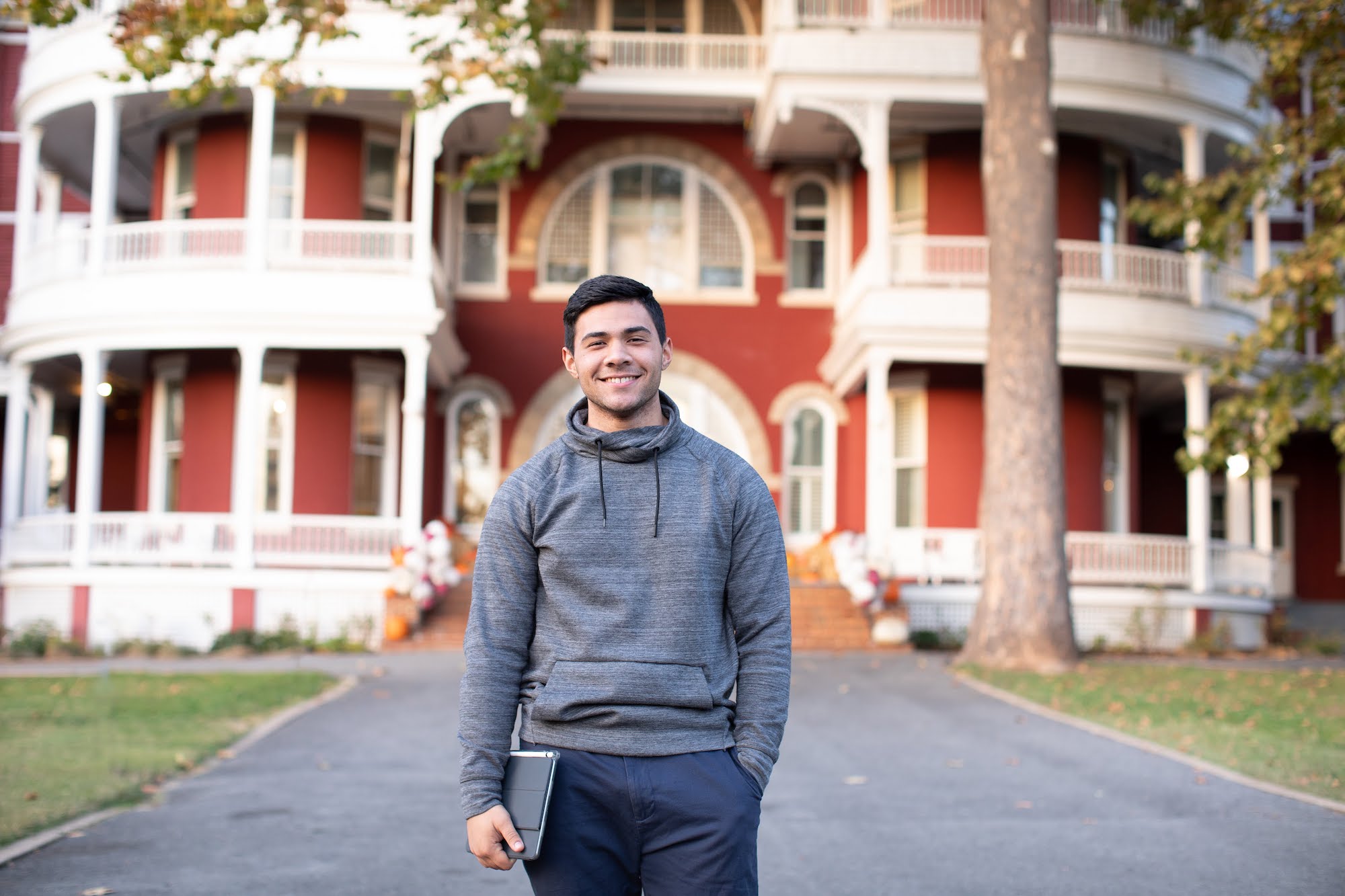 Student standing in front of Main Hall
