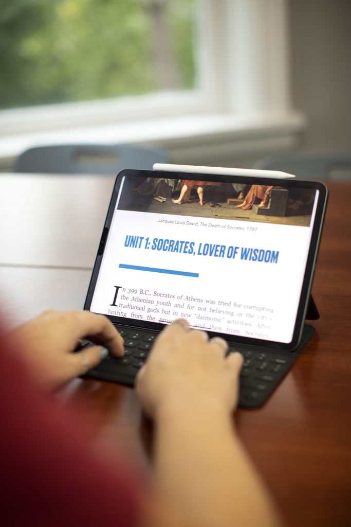 iPad with philosophy textbook open