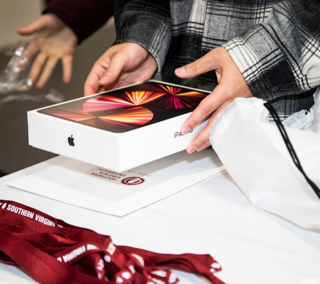 Student holding packaged iPad