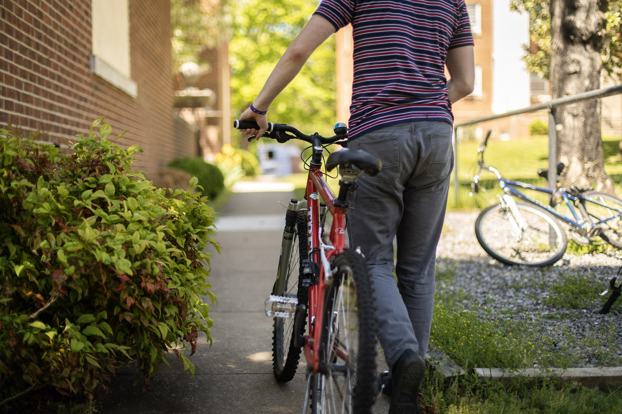 Student with bike at Robey Hall