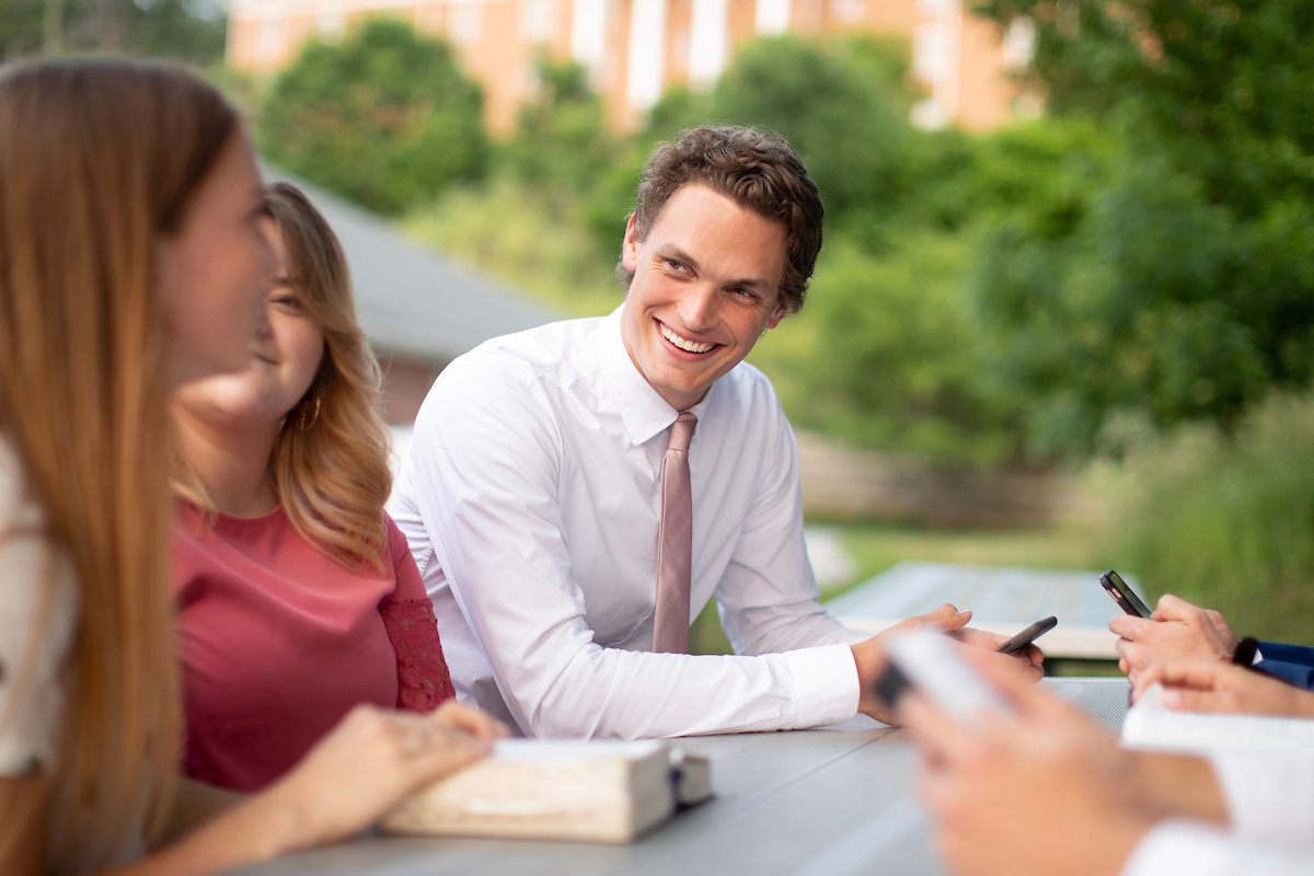 Students studying Come Follow Me.