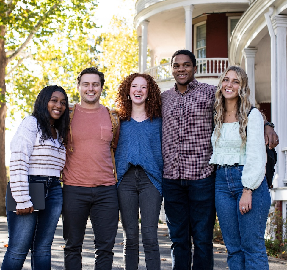 Five students in front of Main Hall.