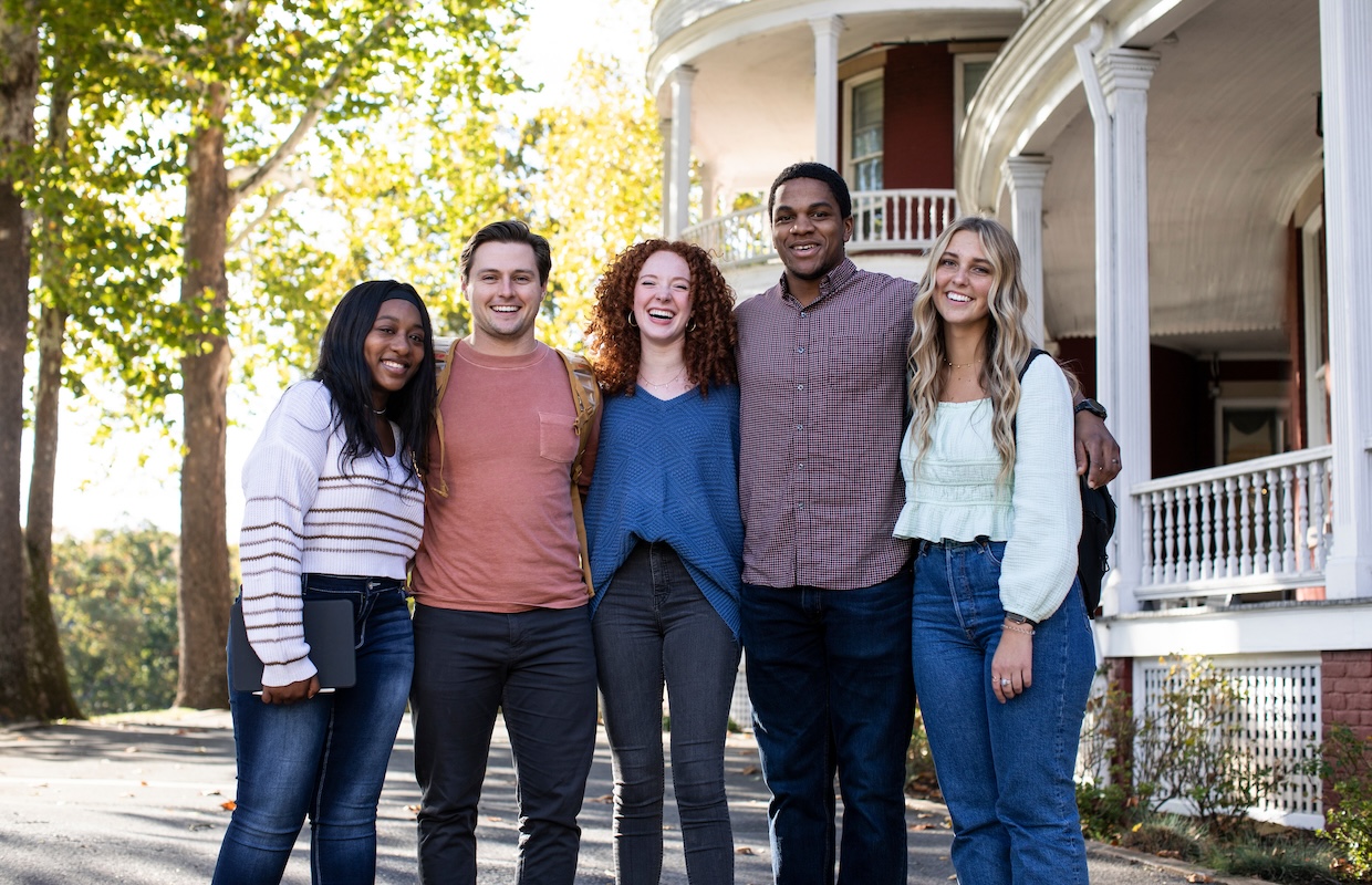 Five students in front of Main Hall.