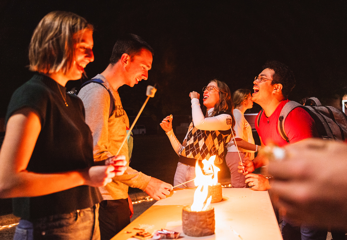 Students roasting marshmallows.