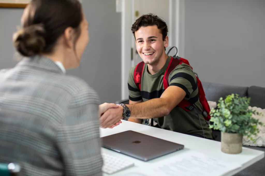 Student shaking hands during interview.