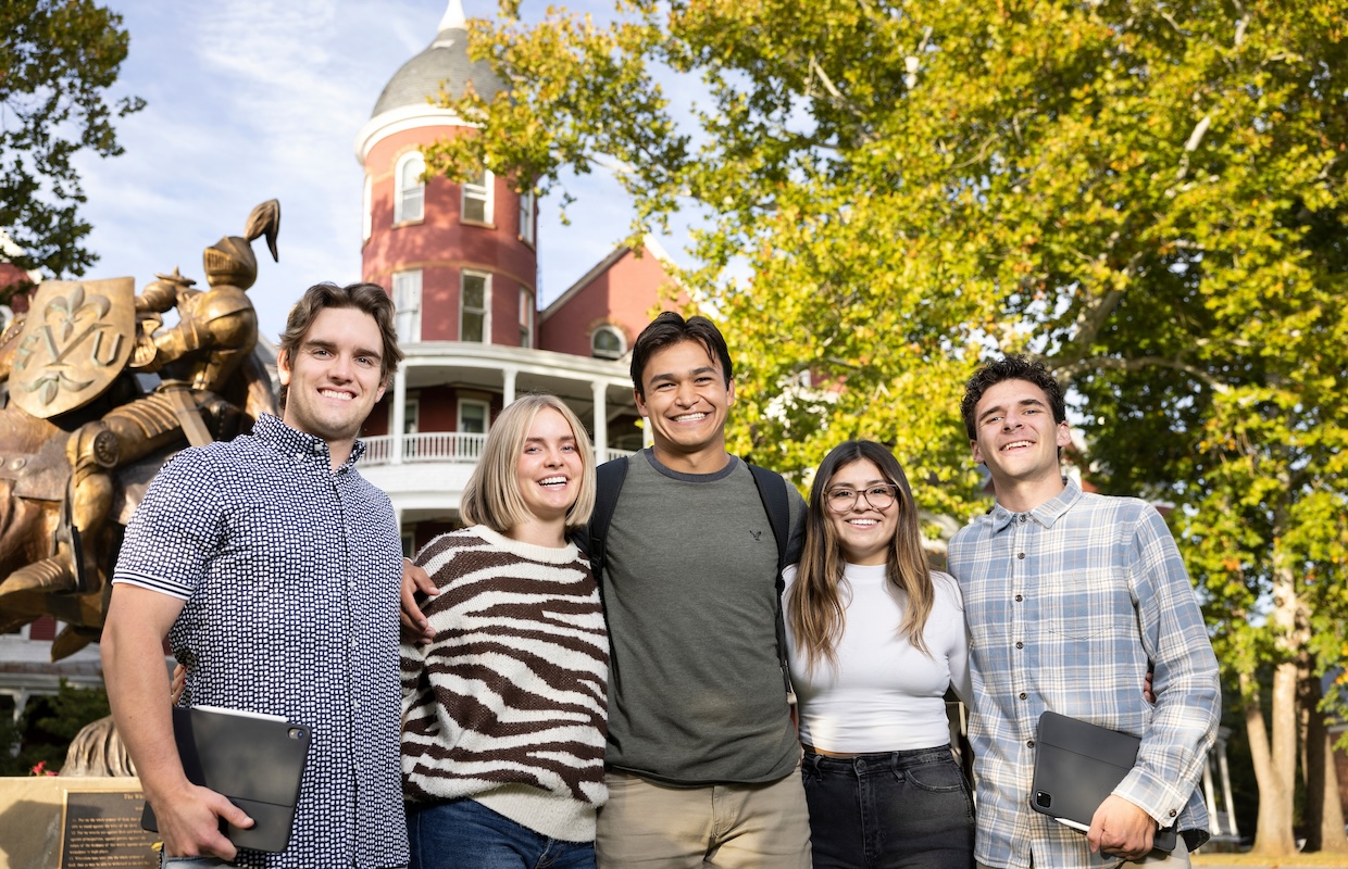 Five students in front of Main Hall