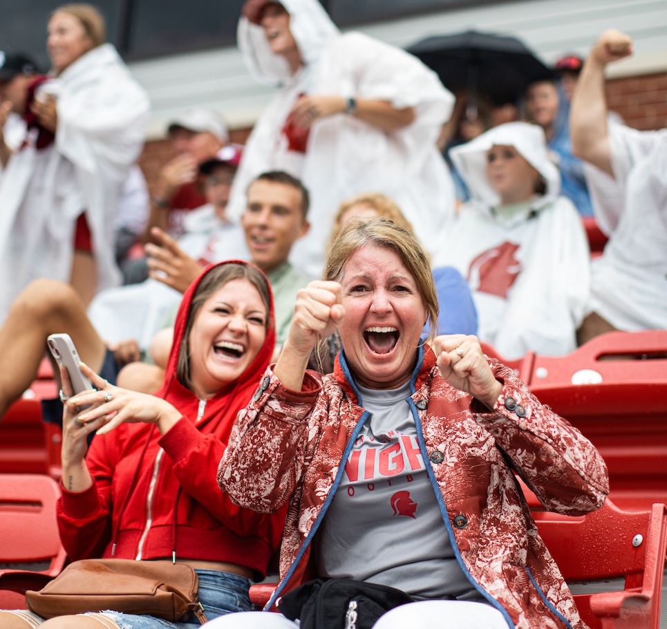 Parents cheering at a football game