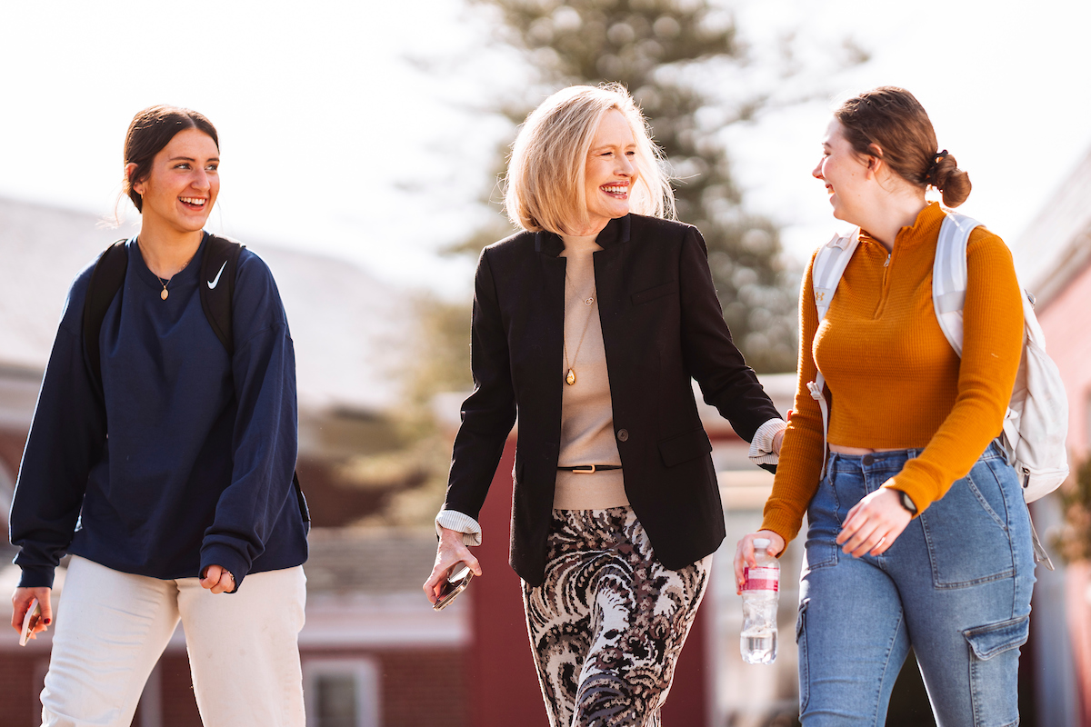 President Cordon walking with students