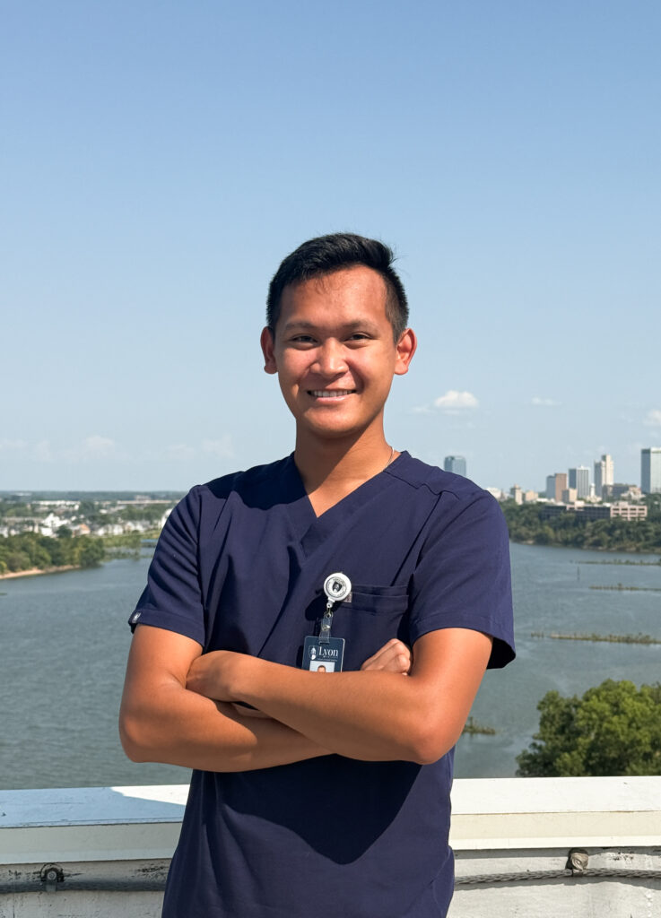 A dentist stands on a bridge over a river